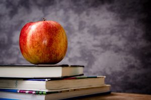 Apple on a pile of books