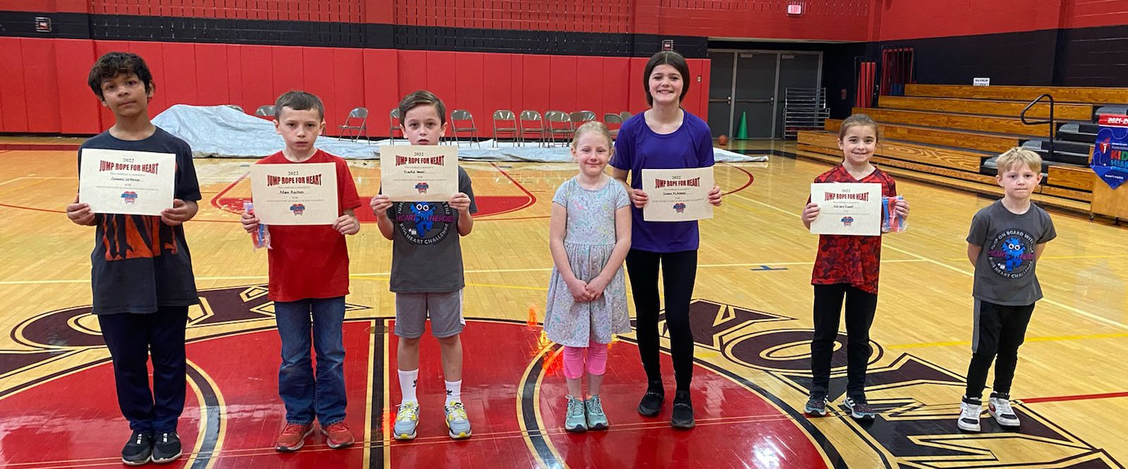 students hold certificates for Jump Rope for Heart
