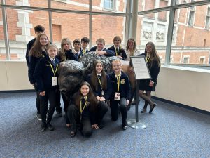 OESJ FFA Students pose celebrate inside the state FFA convention following a year of hard work and success.
