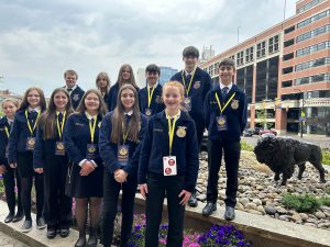 OESJ FFA Students pose for a photo outside the state FFA convention.