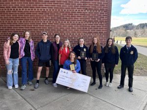 OESJ FFA members stand together as a group celebrating their success