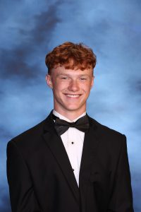 A snapshot of Collin Eakin posing for his senior picture portrait.