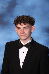 A snapshot of Baler Stowell posing for his senior picture portrait.